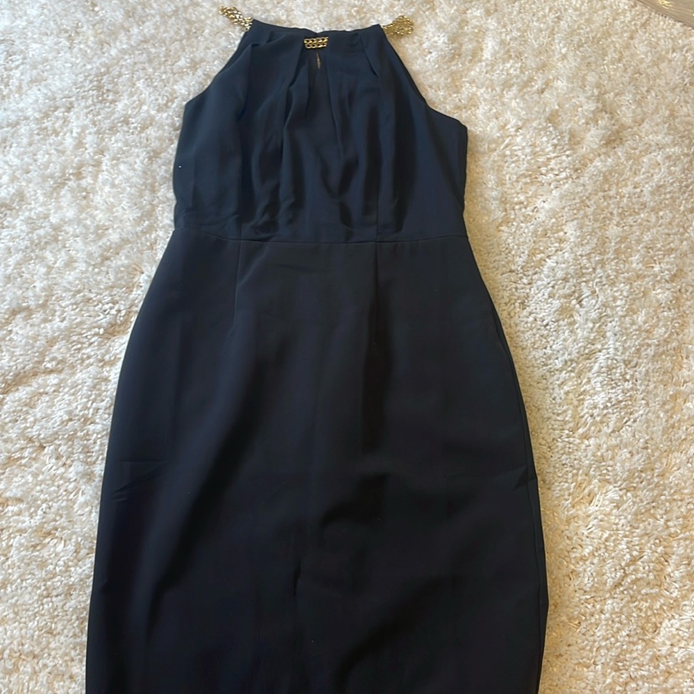 Black, lined sleeveless sundress. Worn twice.
